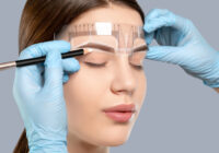 young woman getting eyebrows microbladed